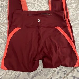 NWOT Lululemon zip the line crop “23 leggings in deep ruby/poppy coral. Size 6